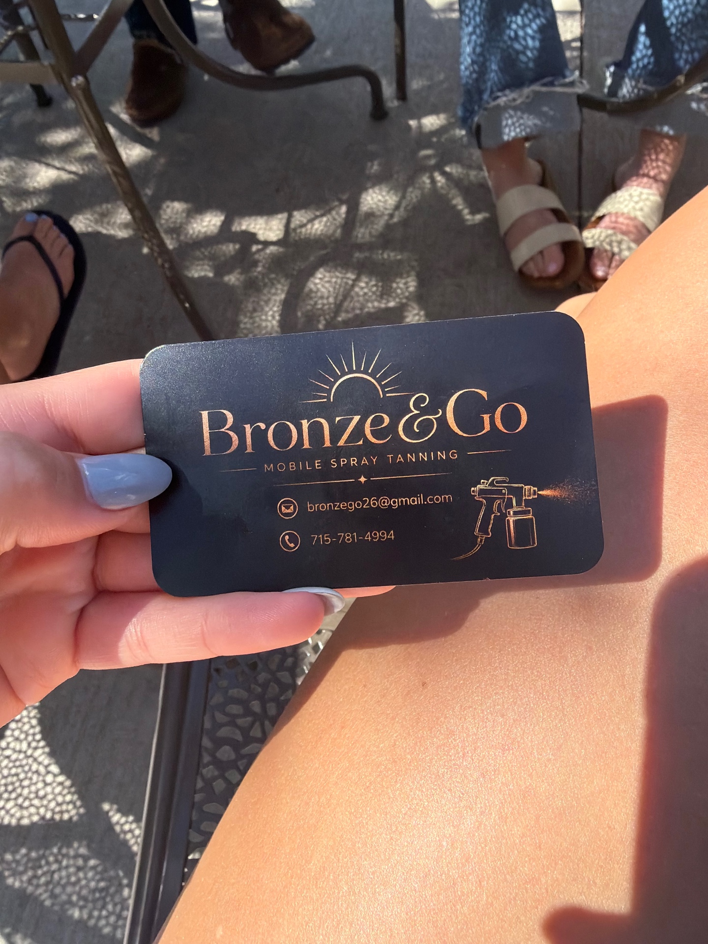 Bronzed leg with Bronze & Go business card